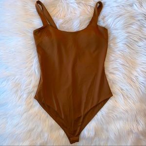 brown bodysuit